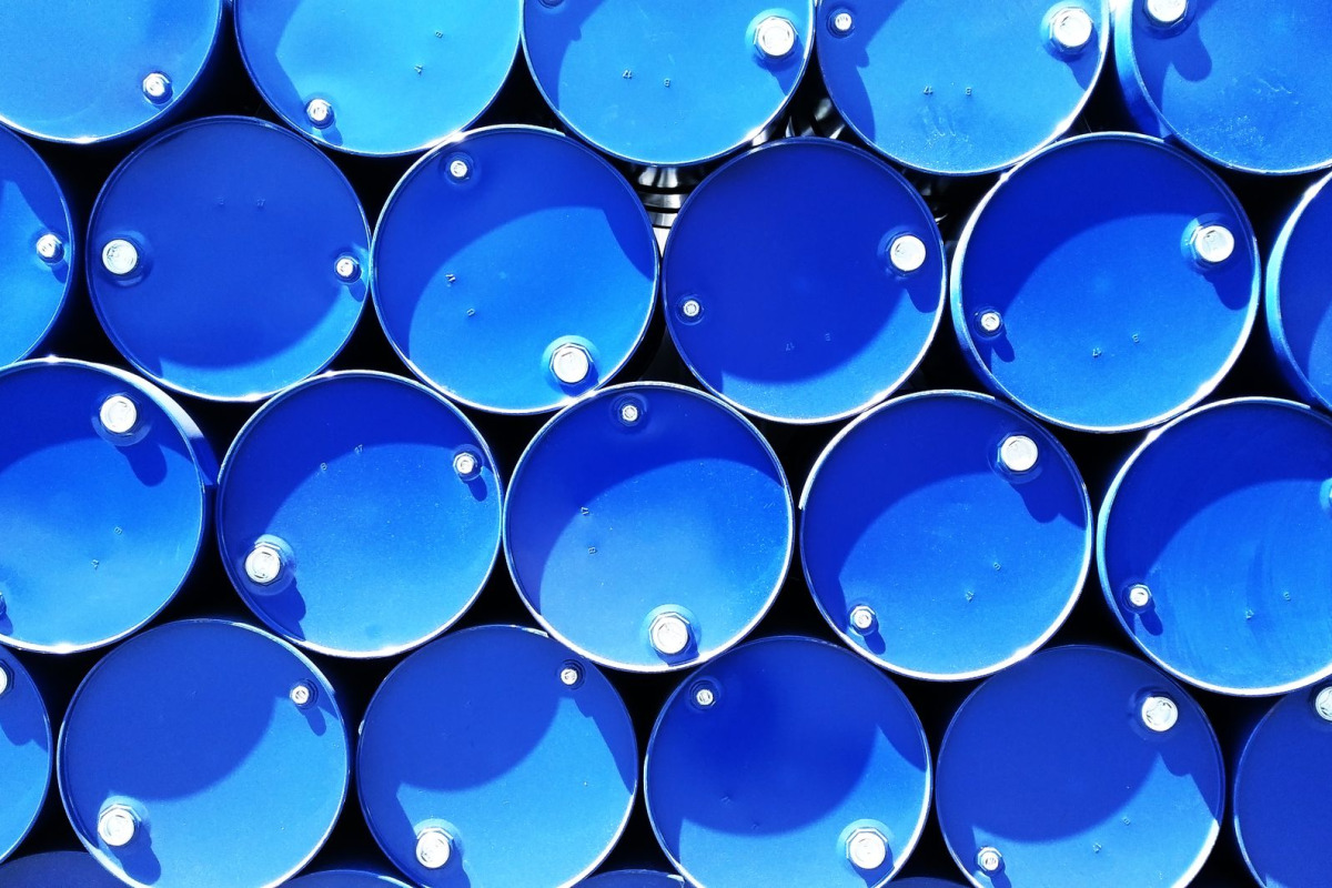 Top view of stacked blue industrial drums forming a geometric pattern.